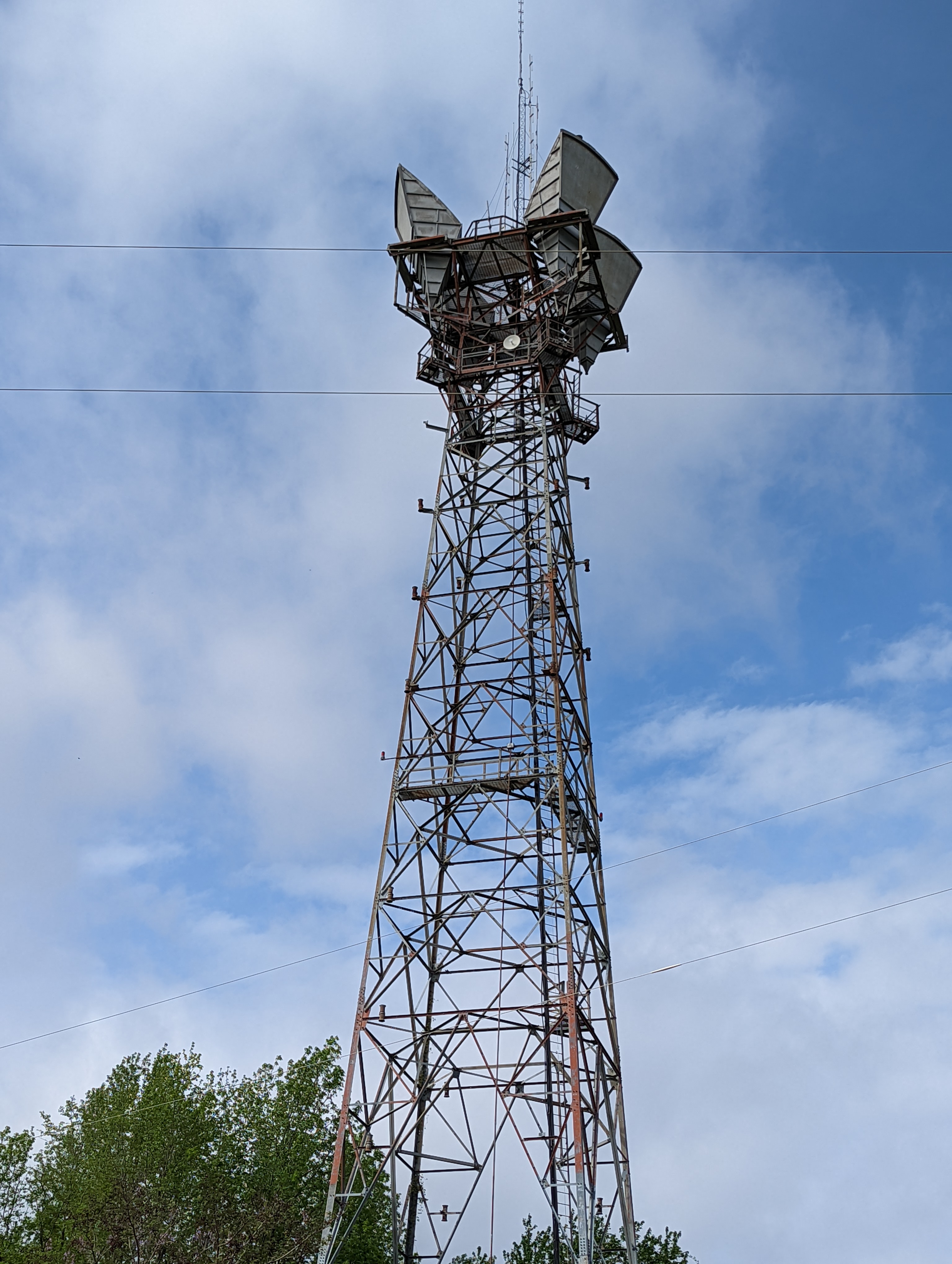 Other image of tower next to a building